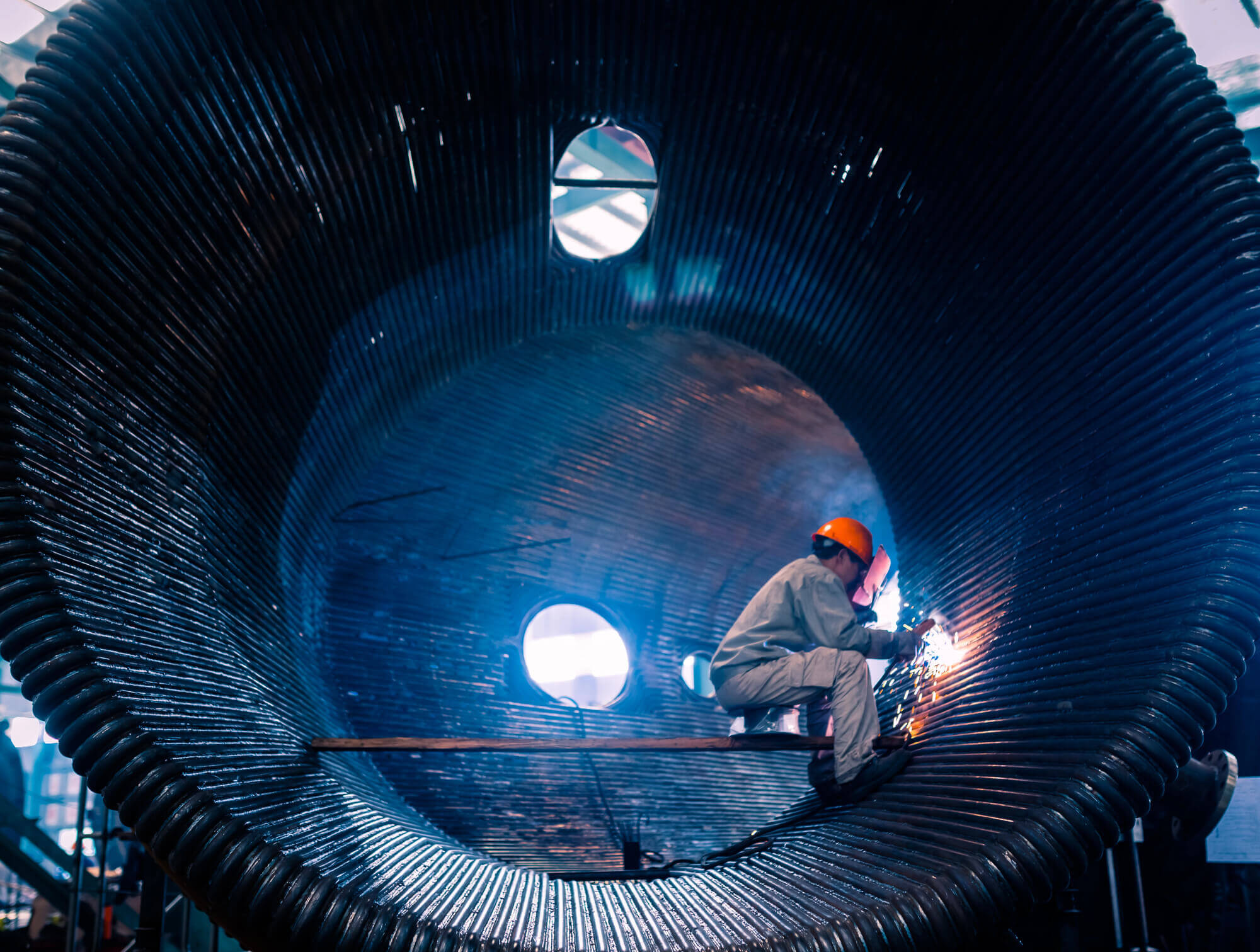 Worker doing electric welding